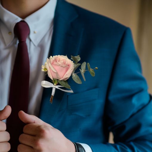 Whimsical Whispers: Blush and Ivory Bridal Themed Boutonniere